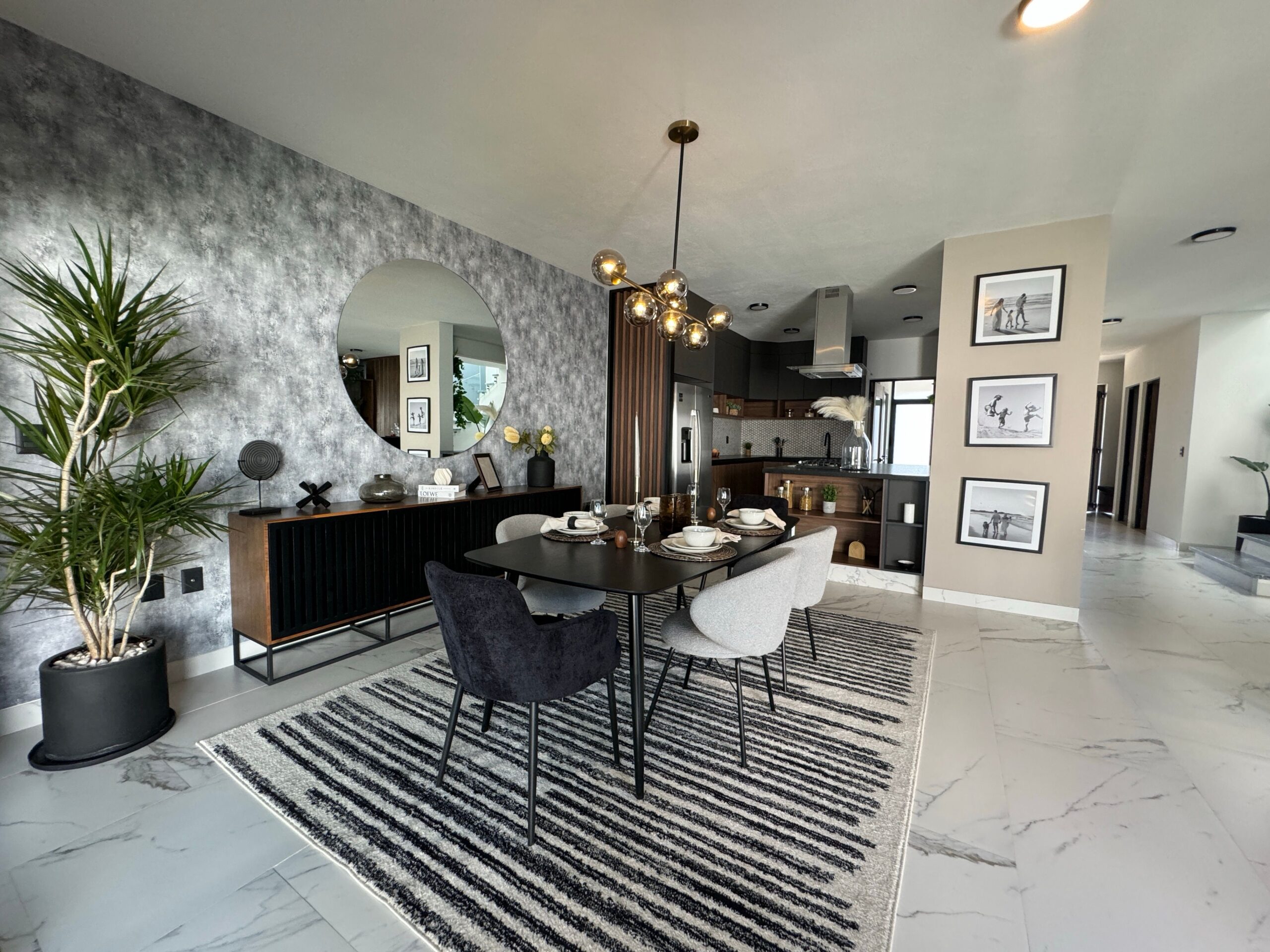 Stylish modern dining room featuring elegant decor and natural lighting for a luxurious ambiance.